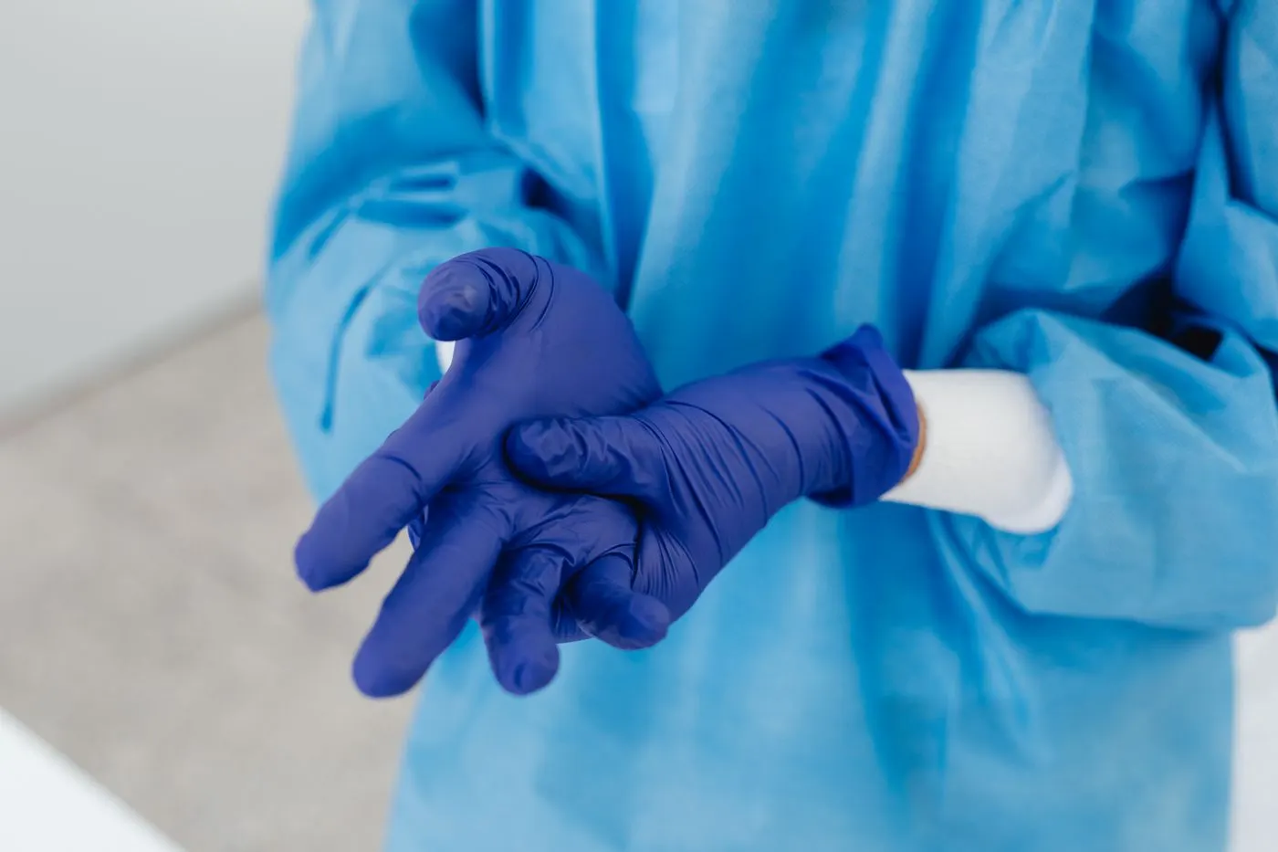 Gown and gloves being put on