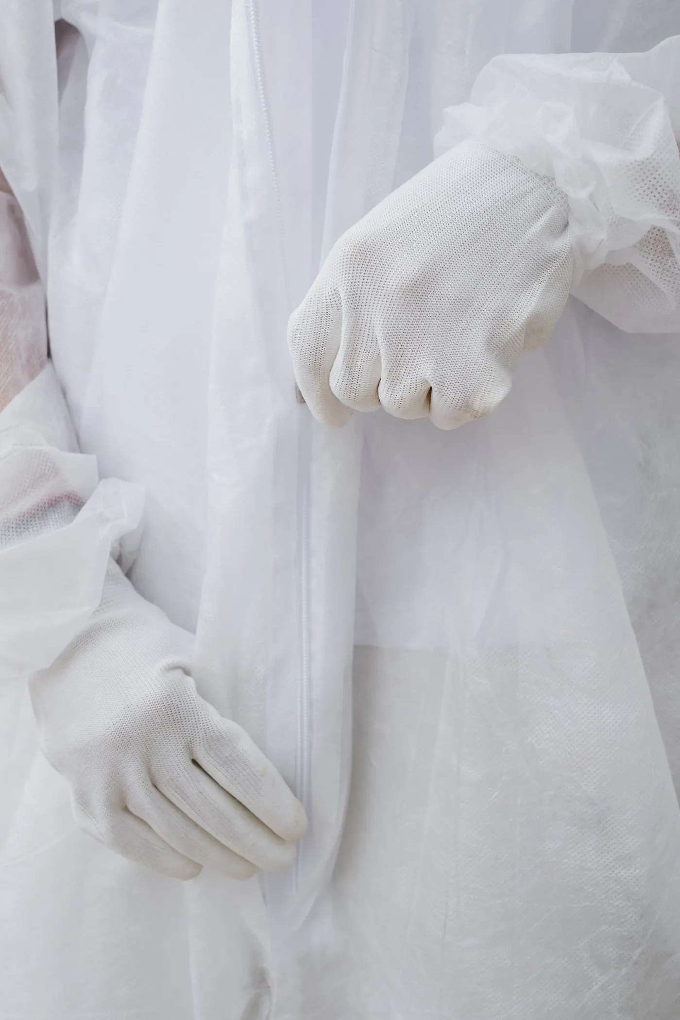 Close-up of protective suit cuff and gloves